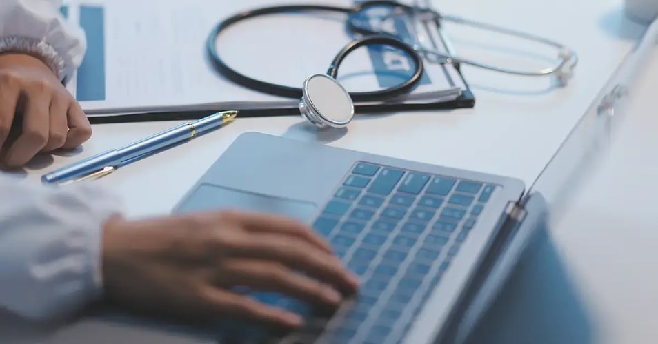 image of a healthcare provider working on a laptop