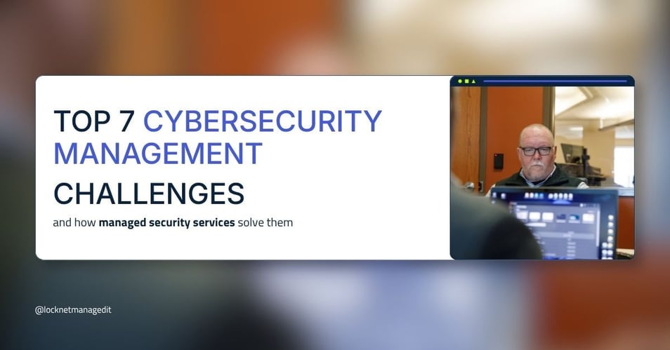 An IT professional monitors security screens in a corporate environment, illustrating the top 7 cybersecurity management challenges that managed security services solve for regulated industries.