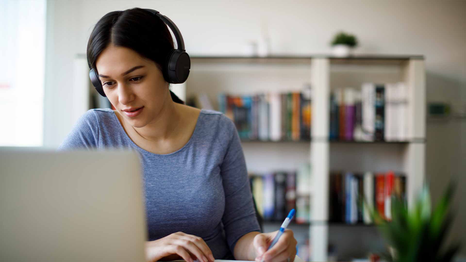 woman_working_from_home_with_headphones_on