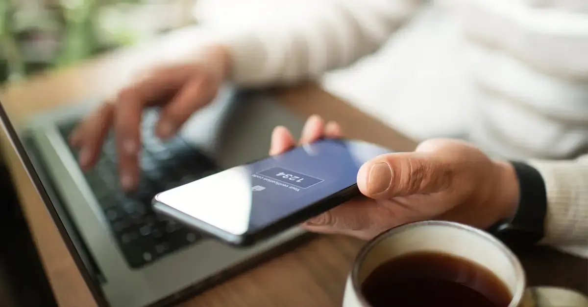 an image of an employee logging into his laptop using multi-factor authentication