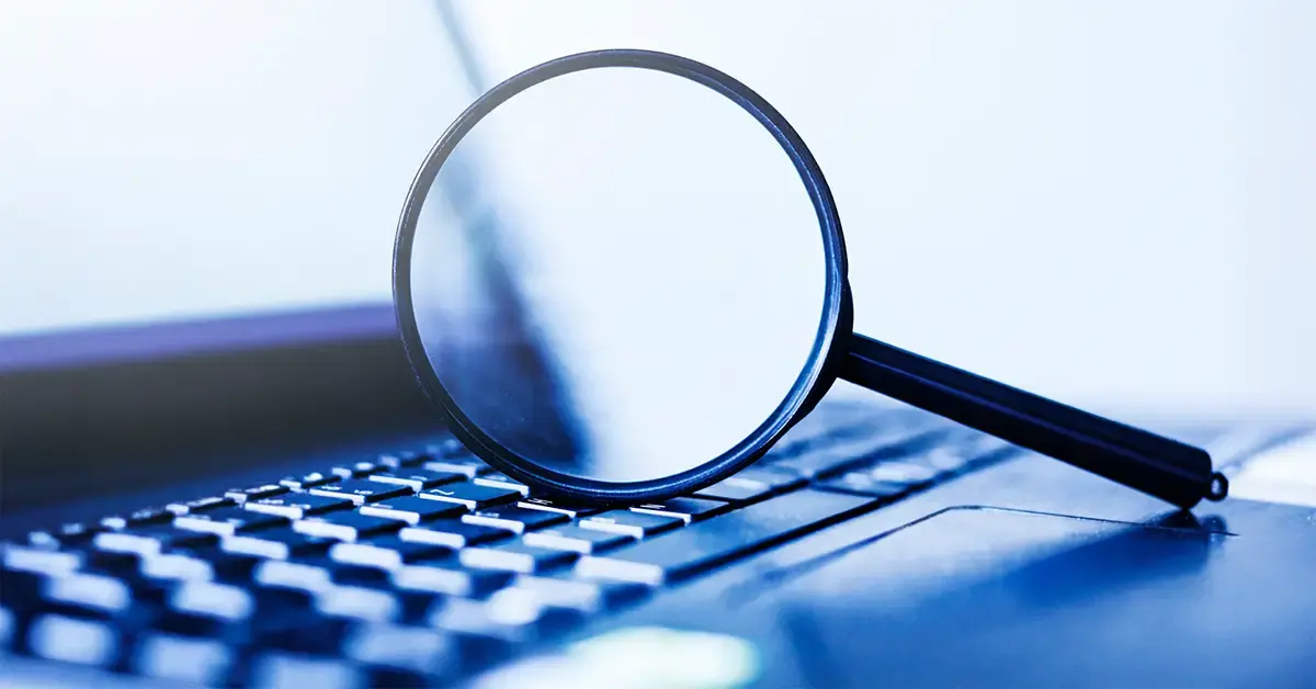 image of a magnifying glass on a laptop